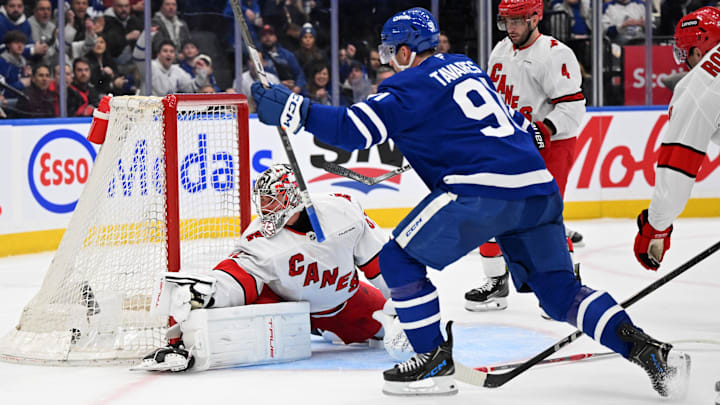 Feb 22, 2025; Toronto, Ontario, CAN;   Toronto Maple Leafs forward John Tavares (91) celebrates after scoring against Carolina Hurricanes goalie Pyotr Kochetkov (52) in the first period at Scotiabank Arena. Mandatory Credit: Dan Hamilton-Imagn Images