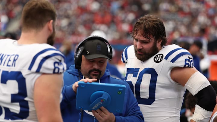 Jan 4, 2026; Houston, Texas, USA;  Indianapolis Colts center Danny Pinter (63) and center Tanor Bortolini (60) review plays on the sidelines during the first half against the Houston Texans at NRG Stadium. Mandatory Credit: Thomas Shea-Imagn Images