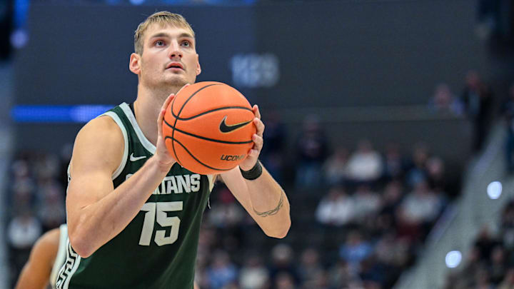 Oct 28, 2025; Hartford, CT, USA; Michigan State Spartans center Carson Cooper (15) shoots a free throw during the second half against the Connecticut Huskies at PeoplesBank Arena. Mandatory Credit: Mark Smith-Imagn Images Oct 28, 2025; Hartford, CT, USA; Michigan State Spartans center Carson Cooper (15) shoots a free throw during the second half against the Connecticut Huskies at PeoplesBank Arena. Mandatory Credit: Mark Smith-Imagn Images