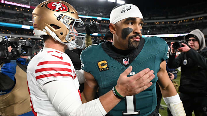 Jan 11, 2026; Philadelphia, PA, USA; San Francisco 49ers quarterback Brock Purdy (13) speaks with Philadelphia Eagles quarterback Jalen Hurts (1) after an NFC Wild Card Round game at Lincoln Financial Field. Mandatory Credit: Eric Hartline-Imagn Images