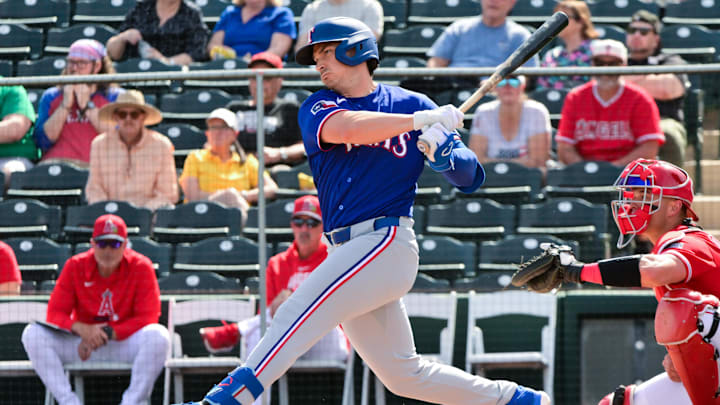 Texas Rangers first baseman Justin Foscue swings the bat during a game.