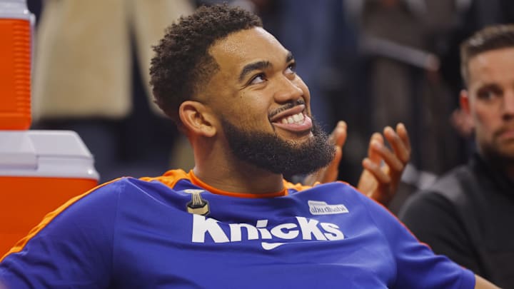 Dec 19, 2024; Minneapolis, Minnesota, USA; New York Knicks forward Karl-Anthony Towns (32) watches a tribute to him played by his former team, the Minnesota Timberwolves, before the game at Target Center.