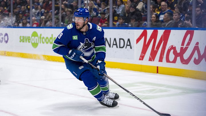 Nov 16, 2024; Vancouver, British Columbia, CAN; Vancouver Canucks forward J.T. Miller (9) handles the puck against the Chicago Blackhawks during the first period at Rogers Arena. Mandatory Credit: Bob Frid-Imagn Images