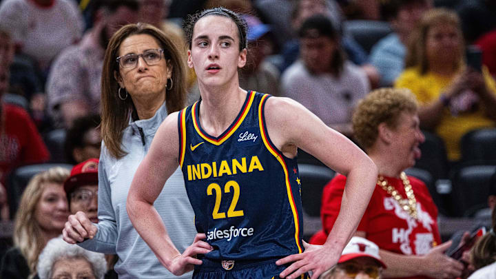 Jun 17, 2025; Indianapolis, Indiana, USA; Indiana Fever guard Caitlin Clark (22)  and head coach Stephanie White in the first half against the Connecticut Sun at Gainbridge Fieldhouse. Mandatory Credit: Trevor Ruszkowski-Imagn Images