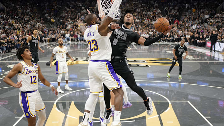 Nov 15, 2024; San Antonio, Texas, USA; San Antonio Spurs guard Stephon Castle (5) shoots over Los Angeles Lakers forward LeBron James (23) during the second half at Frost Bank Center. Mandatory Credit: Scott Wachter-Imagn Images