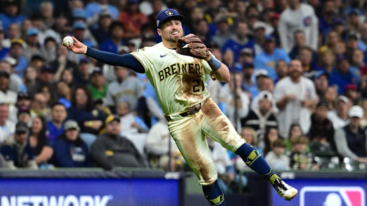 Oct 11, 2025; Milwaukee, Wisconsin, USA; Milwaukee Brewers third baseman Caleb Durbin (21) throws out Chicago Cubs third baseman Matt Shaw (6) in the third inning during game five of the NLDS round for the 2025 MLB playoffs at American Family Field. Mandatory Credit: Benny Sieu-Imagn Images