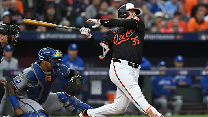 Oct 2, 2024; Baltimore, Maryland, USA; Baltimore Orioles catcher Adley Rutschman (35) hits a single against the Kansas City Royals in the fourth inning in game two of the Wild Card round for the 2024 MLB Playoffs at Oriole Park at Camden Yards. Oct 2, 2024; Baltimore, Maryland, USA; Baltimore Orioles catcher Adley Rutschman (35) hits a single against the Kansas City Royals in the fourth inning in game two of the Wild Card round for the 2024 MLB Playoffs at Oriole Park at Camden Yards.