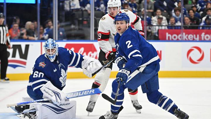 Nov 8, 2023; Toronto, Ontario, CAN; Toronto Maple Leafs defenseman Simon Benoit (2) and goalie Joseph Woll (60) defend their goal area against Ottawa Senators forward Josh Norris (9) in the second period at Scotiabank Arena. Mandatory Credit: Dan Hamilton-Imagn Images