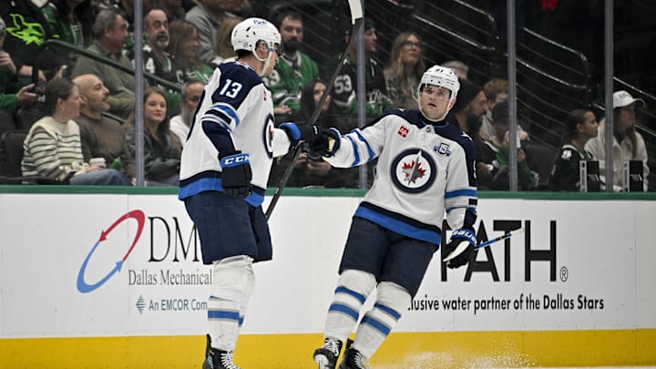 Gabriel Vilardi (13) and Cole Perfetti (91) celebrate a goal against the Dallas Stars during the second period at the American Airlines Center. Gabriel Vilardi (13) and Cole Perfetti (91) celebrate a goal against the Dallas Stars during the second period at the American Airlines Center.