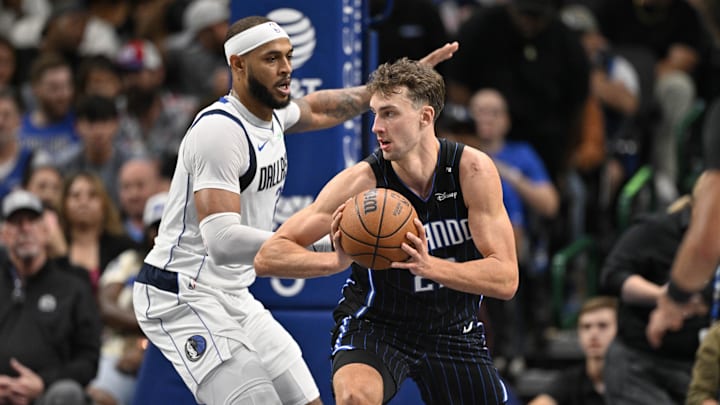 Orlando Magic forward Franz Wagner (22) looks to move the ball past Dallas Mavericks center Daniel Gafford (21) during the second quarter at the American Airlines Center.