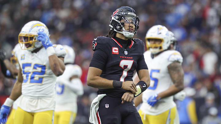Jan 11, 2025; Houston, Texas, USA; Houston Texans quarterback C.J. Stroud (7) reacts during the game against the Los Angeles Chargers in an AFC wild card game at NRG Stadium. Mandatory Credit: Troy Taormina-Imagn Images