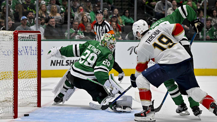 Mar 12, 2024; Dallas, Texas, USA; Florida Panthers left wing Matthew Tkachuk (19) watches as center Aleksander Barkov (not pictured) scores the game-winning goal against Dallas Stars goaltender Jake Oettinger (29) during the third period at the American Airlines Center. Mandatory Credit: Jerome Miron-Imagn Images