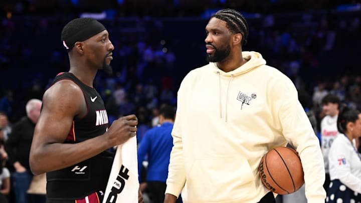 Mar 29, 2025; Philadelphia, Pennsylvania, USA; Miami Heat center Bam Adebayo (13) talks with Philadelphia 76ers center Joel Embiid after the game at Wells Fargo Center. Mandatory Credit: Kyle Ross-Imagn Images