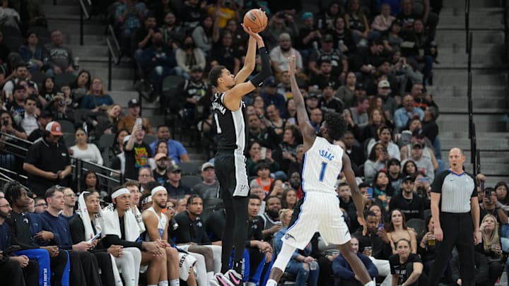 Jan 31, 2024; San Antonio, Texas, USA;  San Antonio Spurs center Victor Wembanyama (1) shoots over Orlando Magic forward Jonathan Isaac (1) in the second half at Frost Bank Center. Mandatory Credit: Daniel Dunn-Imagn Images