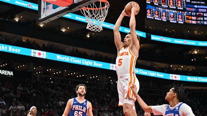 Dyson Daniels #5 of the Atlanta Hawks rises for a dunk against the Philadelphia 76ers.