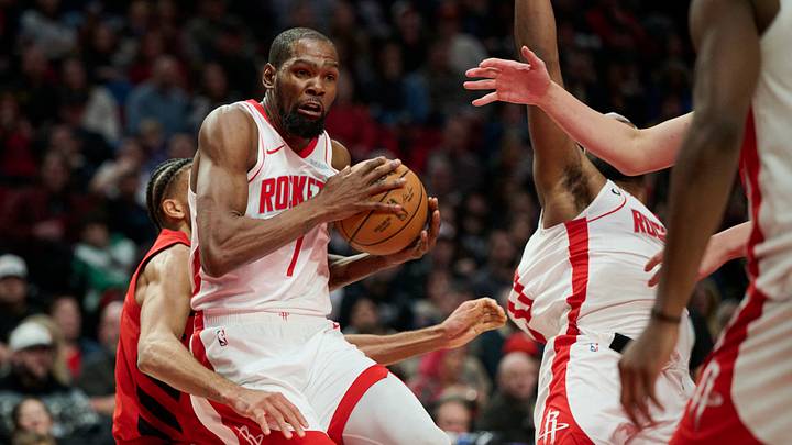 Jan 9, 2026; Portland, Oregon, USA; Houston Rockets forward Kevin Durant (7) grabs a rebound during the second half against Portland Trail Blazers guard Rayan Rupert (21) at Moda Center. Mandatory Credit: Troy Wayrynen-Imagn Images