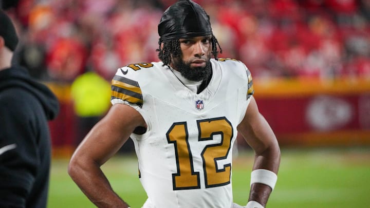 Oct 7, 2024; Kansas City, Missouri, USA; New Orleans Saints wide receiver Chris Olave (12) on the sidelines against the Kansas City Chiefs during the game at GEHA Field at Arrowhead Stadium. Mandatory Credit: Denny Medley-Imagn Images