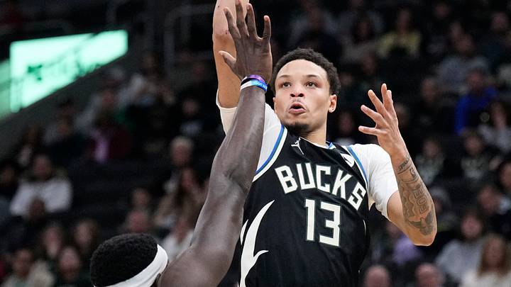 Dec 5, 2025; Milwaukee, Wisconsin, USA; Milwaukee Bucks guard Ryan Rollins (13) puts up a shot against Philadelphia 76ers center Adem Bona (30) in the first half at Fiserv Forum. Mandatory Credit: Michael McLoone-Imagn Images Dec 5, 2025; Milwaukee, Wisconsin, USA; Milwaukee Bucks guard Ryan Rollins (13) puts up a shot against Philadelphia 76ers center Adem Bona (30) in the first half at Fiserv Forum. Mandatory Credit: Michael McLoone-Imagn Images