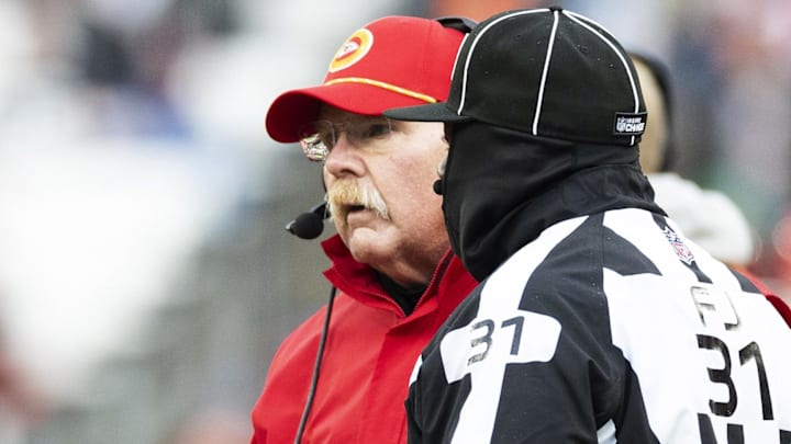 Dec 15, 2024; Cleveland, Ohio, USA; Kansas City Chiefs head coach Andy Reid challenges  a play call with field judge Mearl Robinson (31) during the third quarter against the Cleveland Browns at Huntington Bank Field. Mandatory Credit: Scott Galvin-Imagn Images