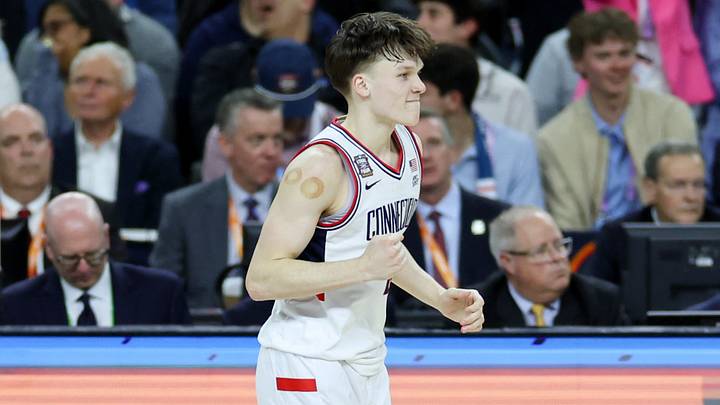 Apr 4, 2026; Indianapolis, IN, USA; UConn Huskies guard Braylon Mullins (24) celebrates after making a three-point basket against the Illinois Fighting Illini in the second half during a semifinal of the Final Four of the men's 2026 NCAA Tournament at Lucas Oil Stadium. Apr 4, 2026; Indianapolis, IN, USA; UConn Huskies guard Braylon Mullins (24) celebrates after making a three-point basket against the Illinois Fighting Illini in the second half during a semifinal of the Final Four of the men's 2026 NCAA Tournament at Lucas Oil Stadium.