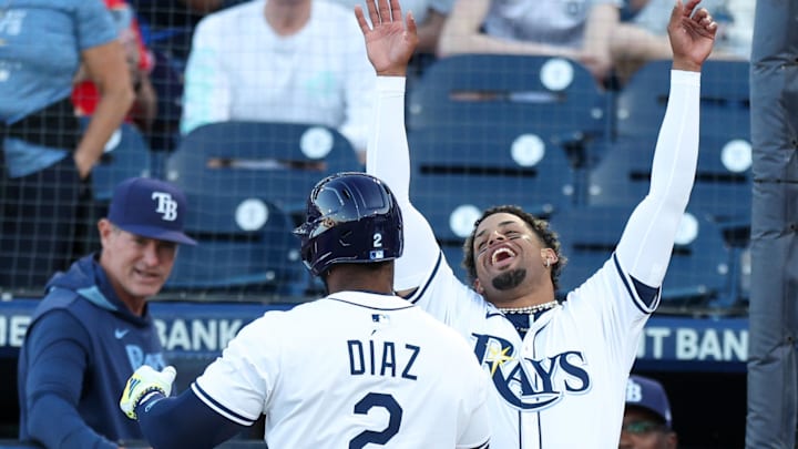 Tampa Bay designated hitter Yandy Diaz (2) celebrates with left fielder Christopher Morel (24) during their rout of Boston.