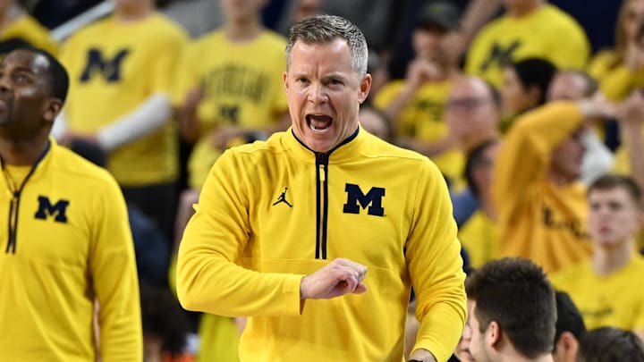 Mar 2, 2025; Ann Arbor, Michigan, USA;  Michigan Wolverines head coach Dusty May yells to his team from in front of the bench area  during their game against the Illinois Fighting Illini in the first half at Crisler Center. Mandatory Credit: Lon Horwedel-Imagn Images