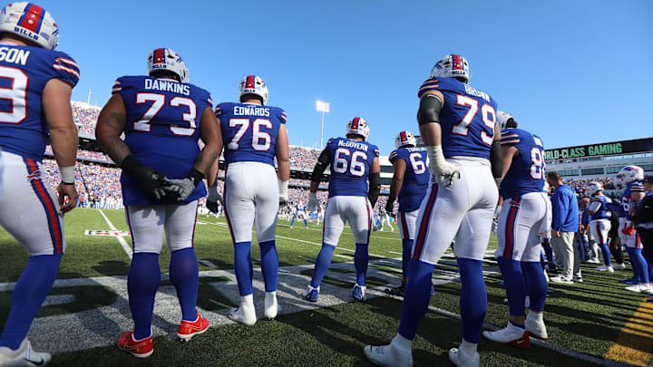 The Buffalo Bills offensive line watches the end of the punt return before taking the field during first half action at Highmark Stadium in Orchard Park on Oct. 20, 2024.