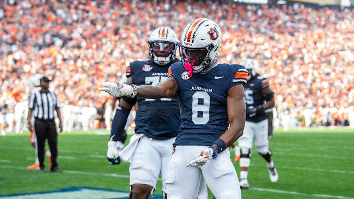 Auburn Tigers wide receiver Cam Coleman (8) celebrates his touchdown as Auburn Tigers take on Mercer Bears at Jordan-Hare Stadium in Auburn, Ala. on Saturday, Nov. 22, 2025. Auburn Tigers lead the Mercer Bears 35-17 at halftime.