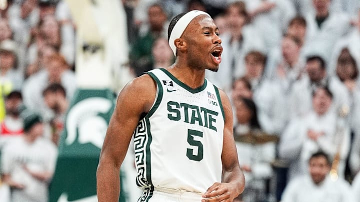 Michigan State guard Tre Holloman (5) celebrates a play against Michigan during the second half at Breslin Center in East Lansing on Sunday, March 9, 2025.