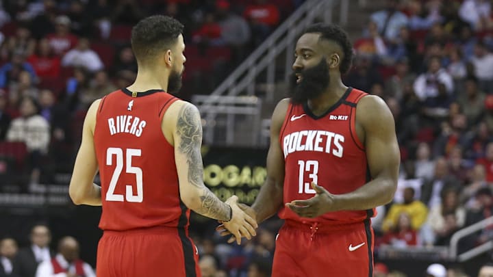 Feb 26, 2020; Houston, Texas, USA; Houston Rockets guard Austin Rivers (25) talks to guard James Harden (13)  while the Rockets play against the Memphis Grizzlies in the second quarter at Toyota Center. Mandatory Credit: Thomas Shea-Imagn Images