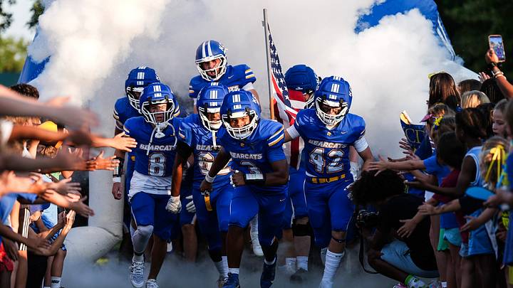 Kentucky Country Day's Eric Forney (3), along with Kentucky Country Day's Nic Doster (8), Kentucky Country Day's Arvin Khehira (62) and Kentucky Country Day's Tripp Swisher (42) lead the Bearcats onto the field before the home opener against visiting Sayre High School during Class 1A KHSAA football. August 21, 2026 Kentucky Country Day's Eric Forney (3), along with Kentucky Country Day's Nic Doster (8), Kentucky Country Day's Arvin Khehira (62) and Kentucky Country Day's Tripp Swisher (42) lead the Bearcats onto the field before the home opener against visiting Sayre High School during Class 1A KHSAA football. August 21, 2026