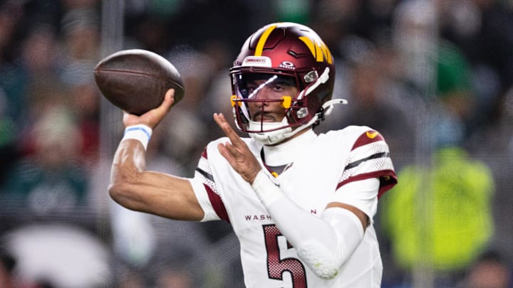 Nov 14, 2024; Philadelphia, Pennsylvania, USA; Washington Commanders quarterback Jayden Daniels (5) throws the ball against the Philadelphia Eagles during the second quarter at Lincoln Financial Field. Mandatory Credit: Bill Streicher-Imagn Images