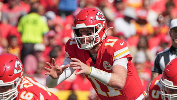 Aug 17, 2024; Kansas City, Missouri, USA; Kansas City Chiefs quarterback Carson Wentz (11) readies for the snap against the Detroit Lions during the game at GEHA Field at Arrowhead Stadium.
