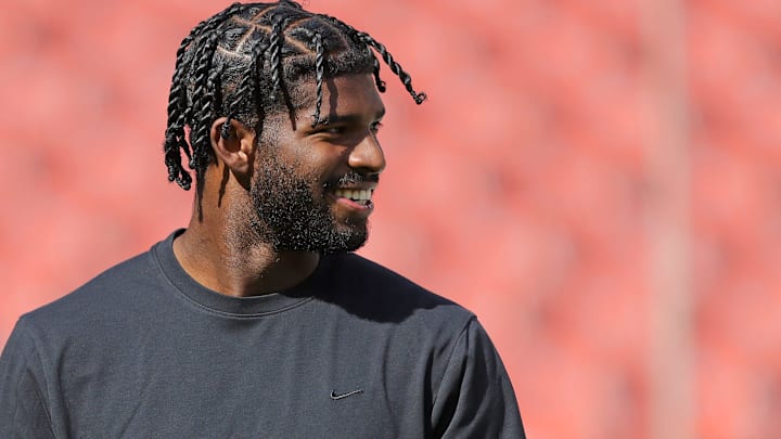 Cleveland Browns quarterback Shedeur Sanders is all smiles as he warms up before an NFL football game at Huntington Bank Field, Sept. 21, 2025, in Cleveland, Ohio.