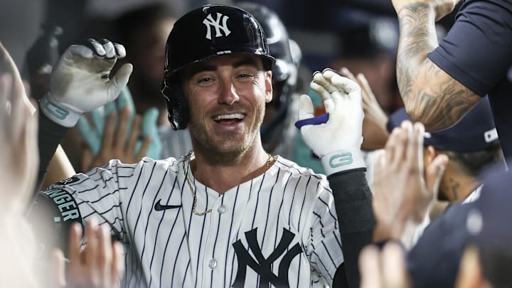 Jul 11, 2025; Bronx, New York, USA;  New York Yankees center fielder Cody Bellinger (35) is greeted in the dugout after hitting a two run home run, his third home run of the game, in the eighth inning against the Chicago Cubs at Yankee Stadium