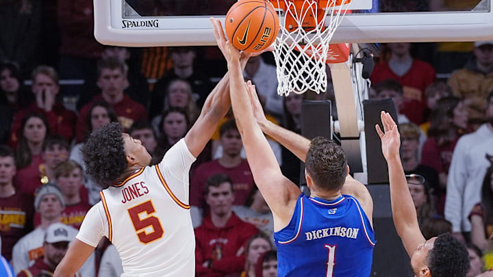 Curtis Jones blocks a shot by Hunter Dickinson last week for Iowa State vs. Kansas.