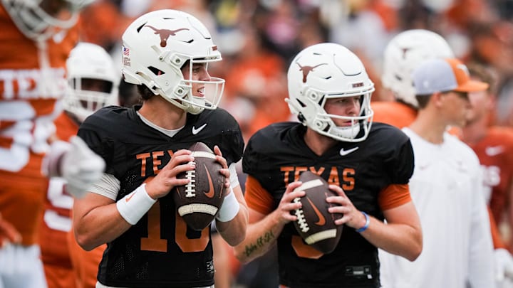 April 20, 2024; Austin, Texas, USA: Texas Longhorns quarterbacks Arch Manning (16), left, and  Quinn Ewers (3) throw passes while warming up ahead of the Longhorns' spring Orange and White game at Darrell K Royal Texas Memorial Stadium. Mandatory Credit: Sara Diggins-Imagn Images via American Statesman