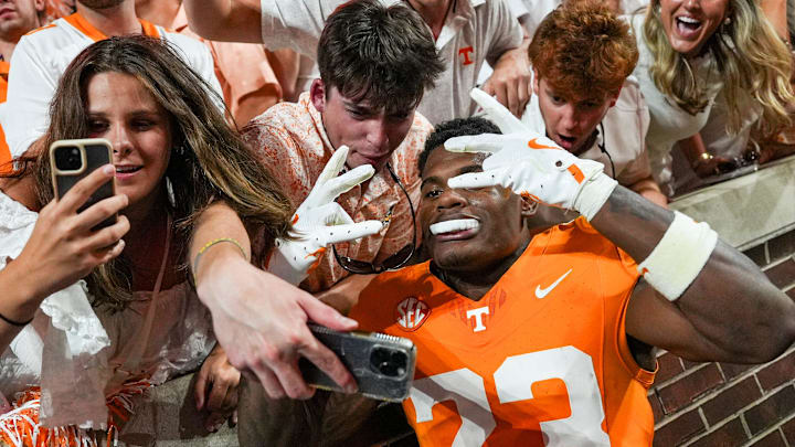 Tennessee defensive back Boo Carter (23) takes a selfie with fans during a SEC conference game between Tennessee and Florida in Neyland Stadium on Saturday, Oct. 12, 2024. Tennessee defensive back Boo Carter (23) takes a selfie with fans during a SEC conference game between Tennessee and Florida in Neyland Stadium on Saturday, Oct. 12, 2024.