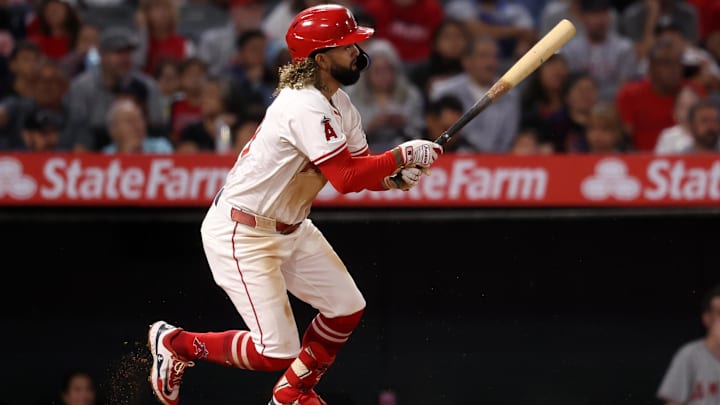 Sep 28, 2024; Anaheim, California, USA;  Los Angeles Angels shortstop Jack Lopez (10) hits a RBI single during the second inning against the Texas Rangers at Angel Stadium. Mandatory Credit: Kiyoshi Mio-Imagn Images