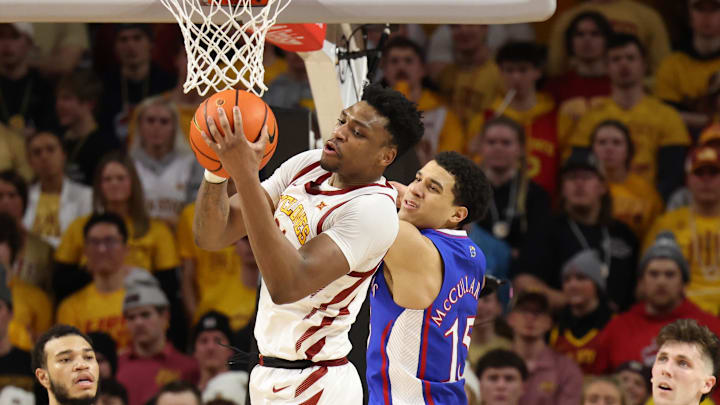Feb 4, 2023; Ames, Iowa, USA; Iowa State Cyclones center Osun Osunniyi (21) blocks out Kansas guard Kevin McCullar Jr. (15)