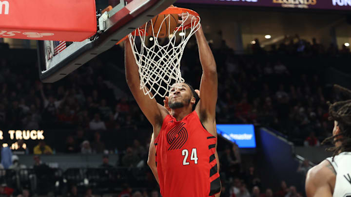 Nov 26, 2025; Portland, Oregon, USA; Portland Trail Blazers forward Kris Murray (24) dunks the ball against the San Antonio Spurs in the first half at Moda Center. Mandatory Credit: Jaime Valdez-Imagn Images