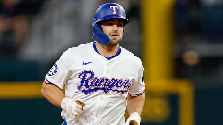 Sep 21, 2024; Arlington, Texas, USA; Texas Rangers short stop Josh Smith (8) hits a two-run home run during the third inning against the Seattle Marinersat Globe Life Field.