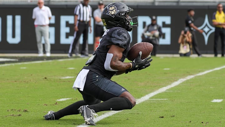 Nov 25, 2023; Orlando, Florida, USA; UCF Knights running back Johnny Richardson (0) catches a kick during the first quarter against the Houston Cougars at FBC Mortgage Stadium. Mandatory Credit: Mike Watters-USA TODAY Sports
