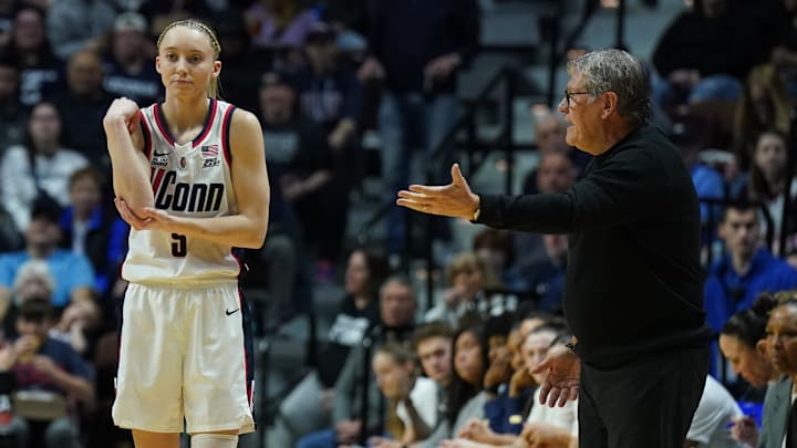 Mar 8, 2025; Uncasville, CT, USA; UConn Huskies head coach Geno Auriemma talks to guard Paige Bueckers (5) from the sideline as they take on the St. John's Red Storm at Mohegan Sun Arena. Mandatory Credit: David Butler II-Imagn Images
