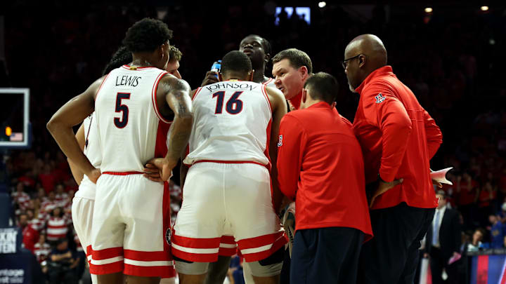 Jan 20, 2024; Tucson, Arizona, USA; Arizona Wildcats head coach Tommy Lloyd talks to guard KJ Lewis (5), forward Keshad Johnson (16), and center Oumar Ballo (11) during a timeout against the UCLA Bruins during the second half at McKale Center.