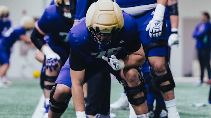 Jake Flores gets into a stance inside Dempsey Indoor. Jake Flores gets into a stance inside Dempsey Indoor.