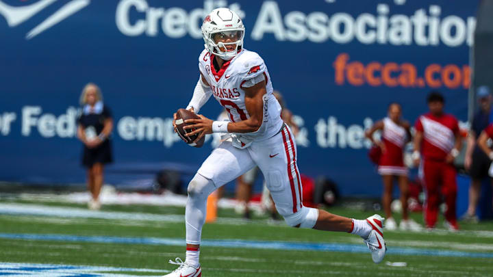Sep 20, 2025; Memphis, Tennessee, USA; Arkansas Razorbacks quarterback Taylen Green (10) scrambles with the ball against the Memphis Tigers during the second half at Simmons Bank Liberty Stadium. Mandatory Credit: Wesley Hale-Imagn Images