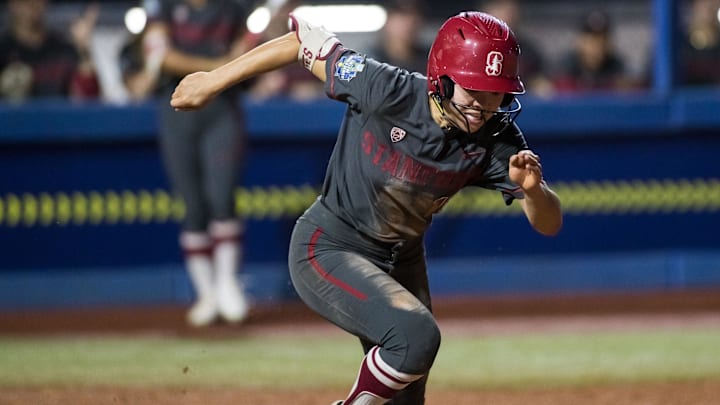 Jun 2, 2024; Oklahoma City, OK, USA; Stanford Cardinals infielder Emily Jones (18) runs to first fin the fifth inning against the UCLA Bruins during a Women's College World Series softball losers bracket elimination game at Devon Park. Mandatory Credit: Brett Rojo-Imagn Images Jun 2, 2024; Oklahoma City, OK, USA; Stanford Cardinals infielder Emily Jones (18) runs to first fin the fifth inning against the UCLA Bruins during a Women's College World Series softball losers bracket elimination game at Devon Park. Mandatory Credit: Brett Rojo-Imagn Images