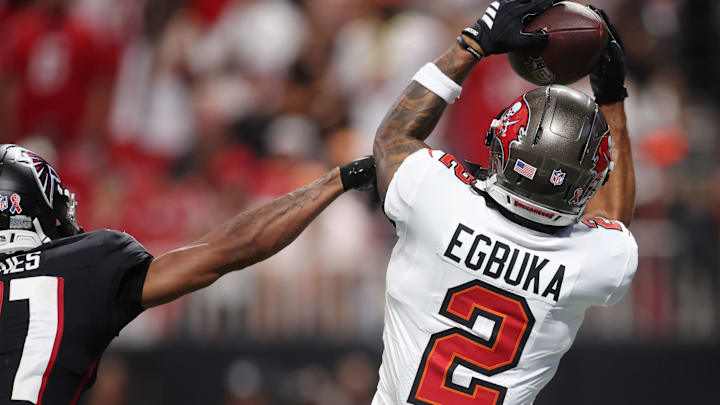Sep 7, 2025; Atlanta, Georgia, USA; Tampa Bay Buccaneers wide receiver Emeka Egbuka (2) makes a catch against Atlanta Falcons cornerback Mike Hughes (21) for a touchdown during the fourth quarter at Mercedes-Benz Stadium. Mandatory Credit: Brett Davis-Imagn Images