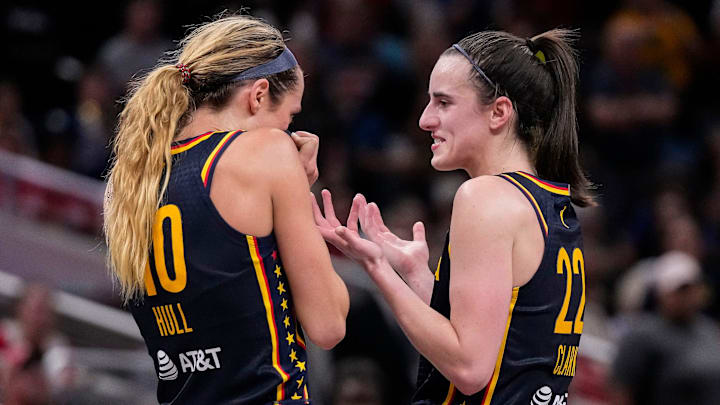 Indiana Fever guard Caitlin Clark (22) and Indiana Fever guard Lexie Hull (10) talk during a timeout on Sunday, Sept. 15, 2024, during the game at Gainbridge Fieldhouse in Indianapolis. The Indiana Fever defeated the Dallas Wings, 110-109.